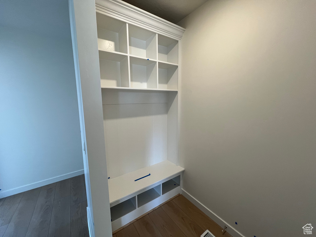 Mudroom with baseboards and dark wood finished floors