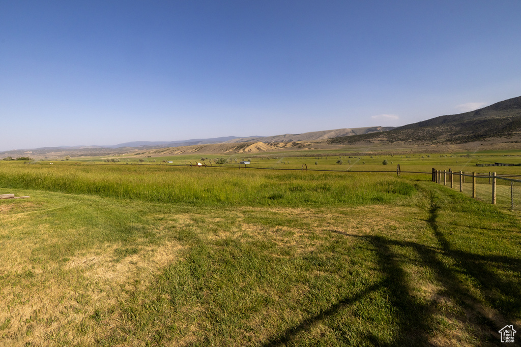 View of mountain backdrop with rural landscape
