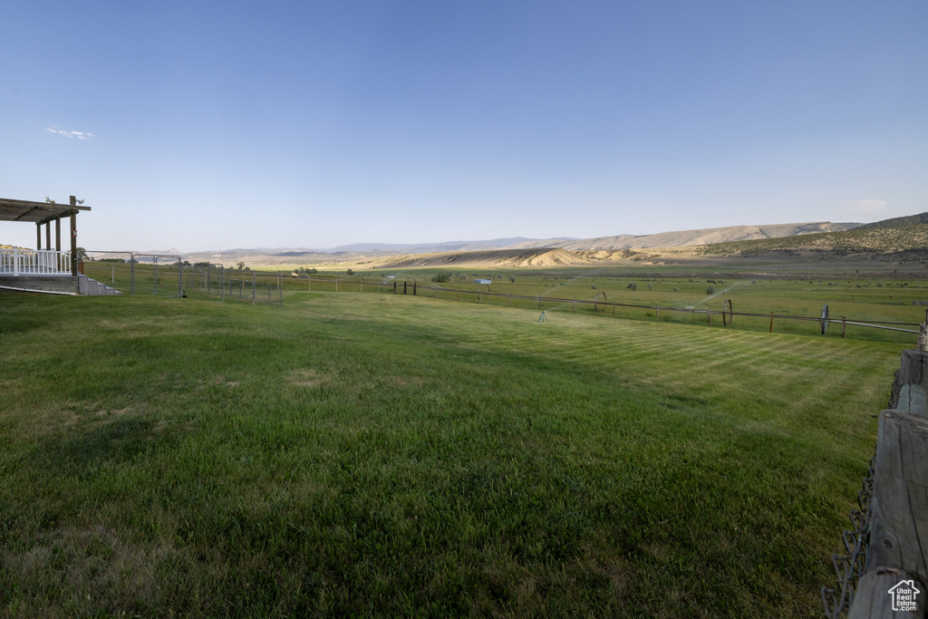 View of yard with a view of rural / pastoral area and a mountain view