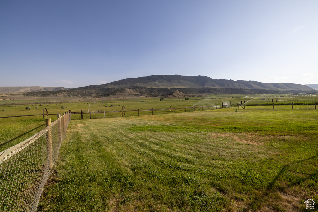 View of mountain backdrop with rural landscape and a pastoral area