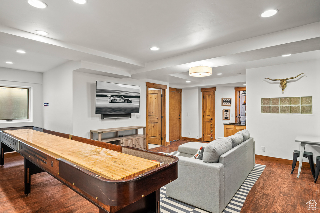 Recreation room with recessed lighting and dark wood-style flooring