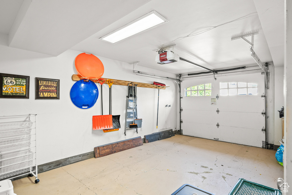 Garage featuring a garage door opener
