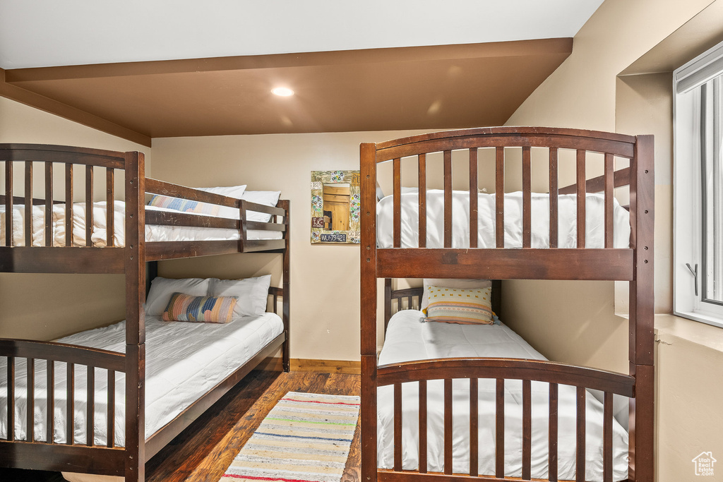 Bedroom with wood finished floors and recessed lighting