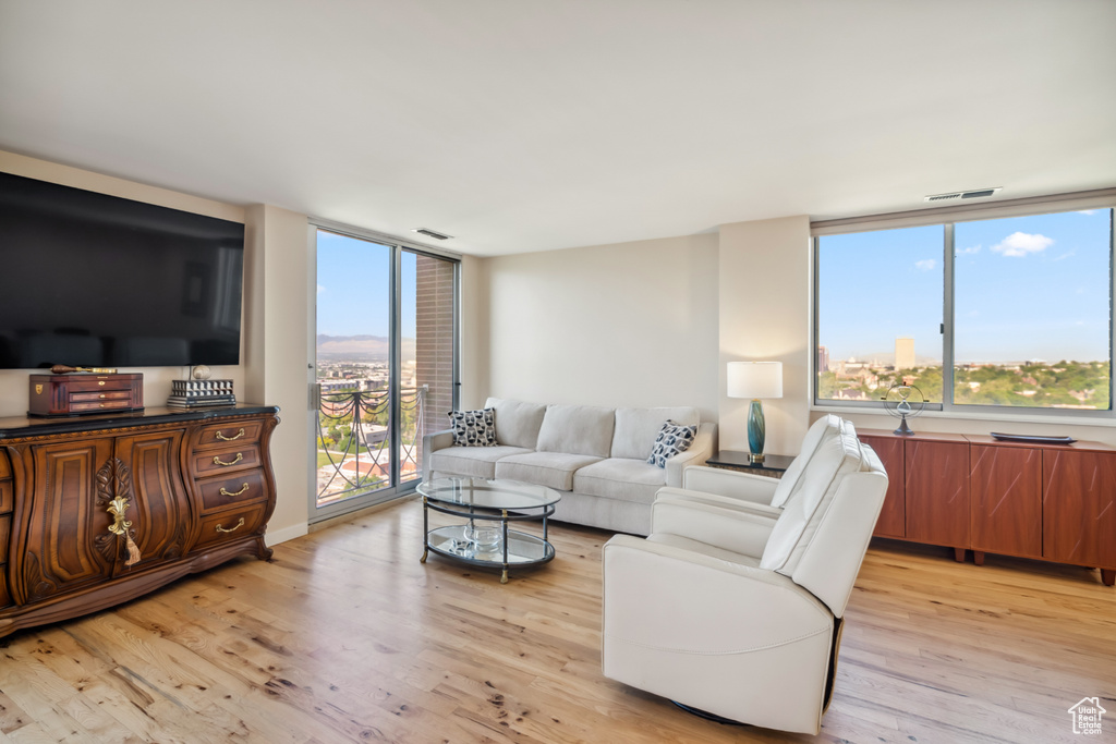 Living room with light wood-style flooring
