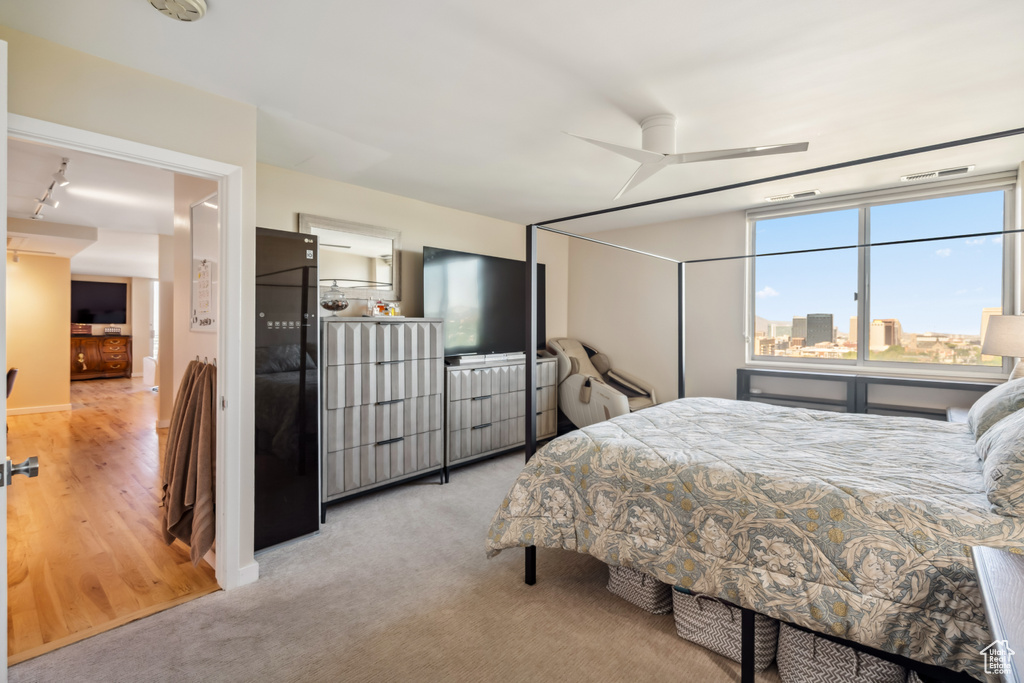 Bedroom with light carpet