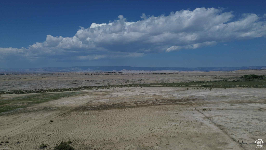 View of yard featuring a mountain view and a view of countryside
