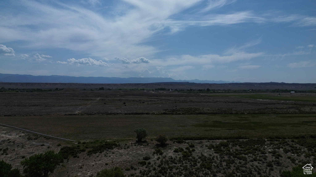 View of mountain backdrop with rural landscape