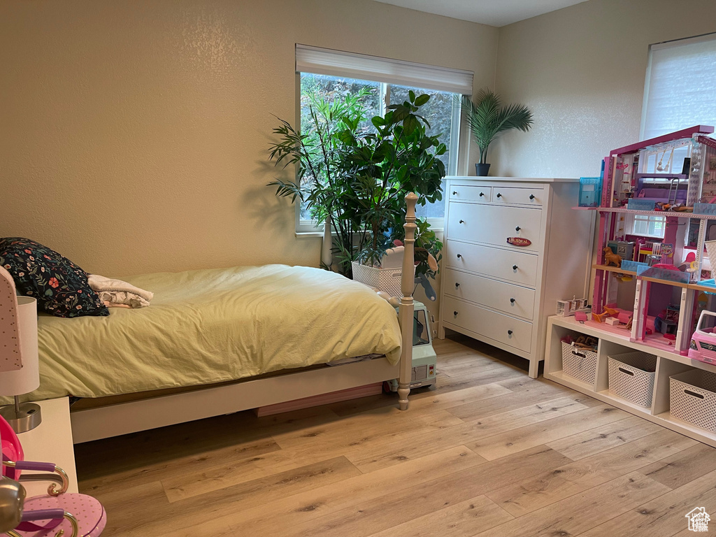 Bedroom with wood finished floors