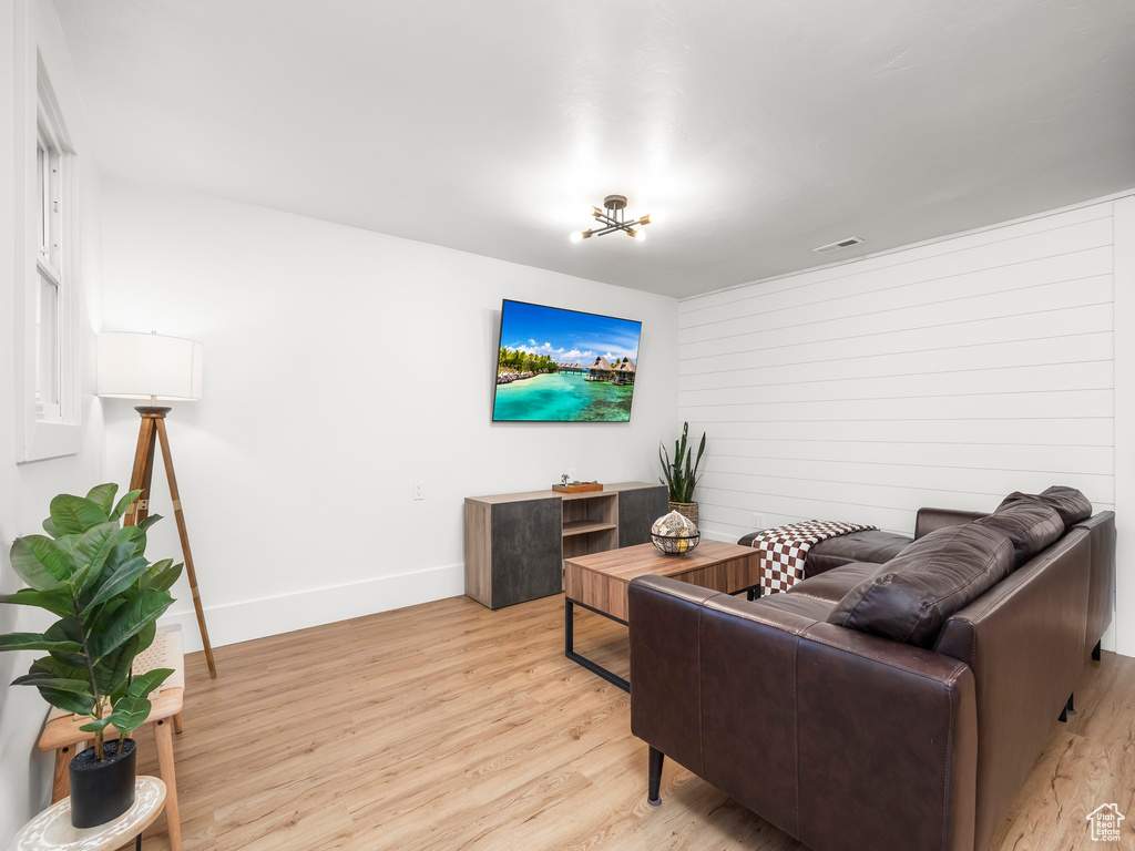 Living area featuring light wood-type flooring and baseboards