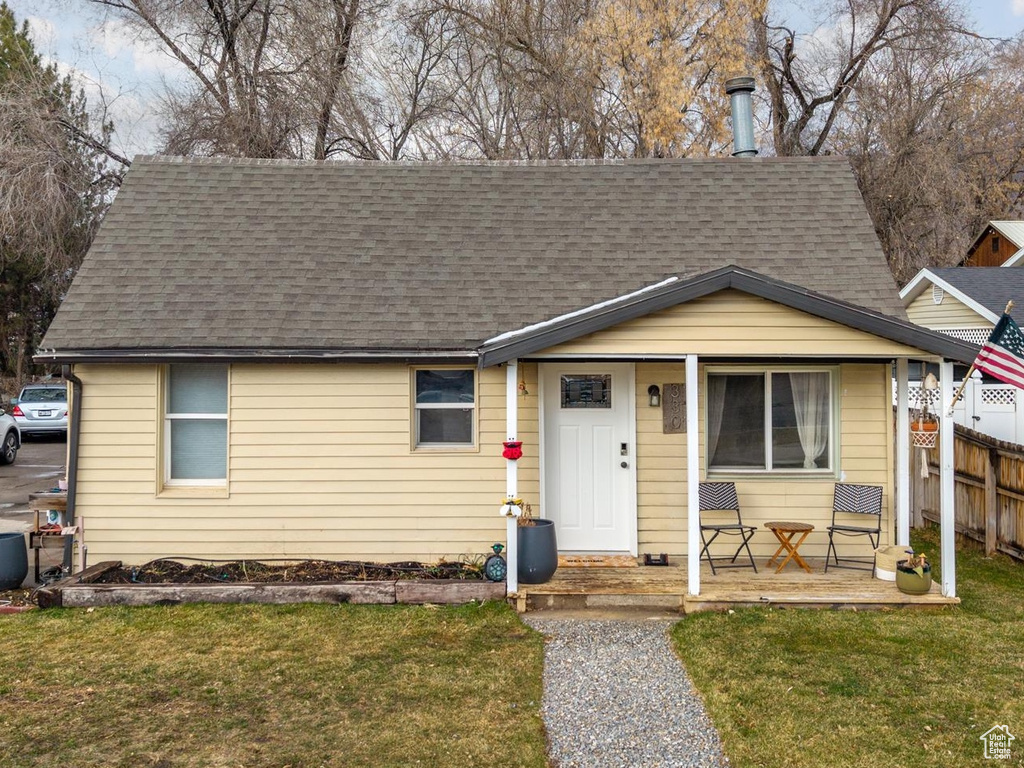 Bungalow-style house with a porch and roof with shingles