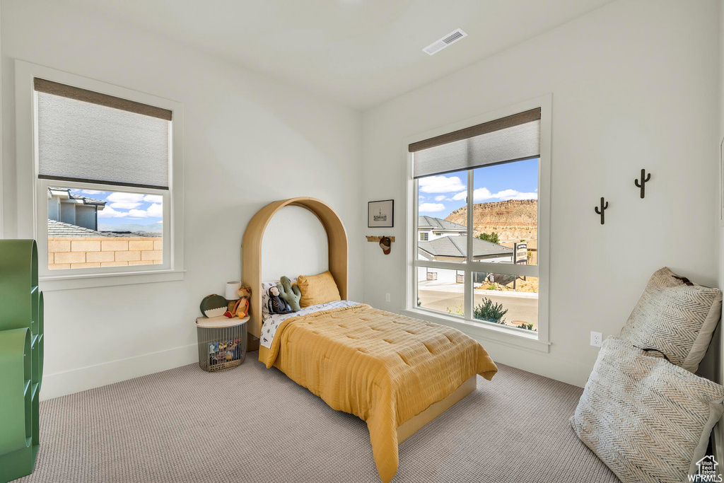 Carpeted bedroom with baseboards