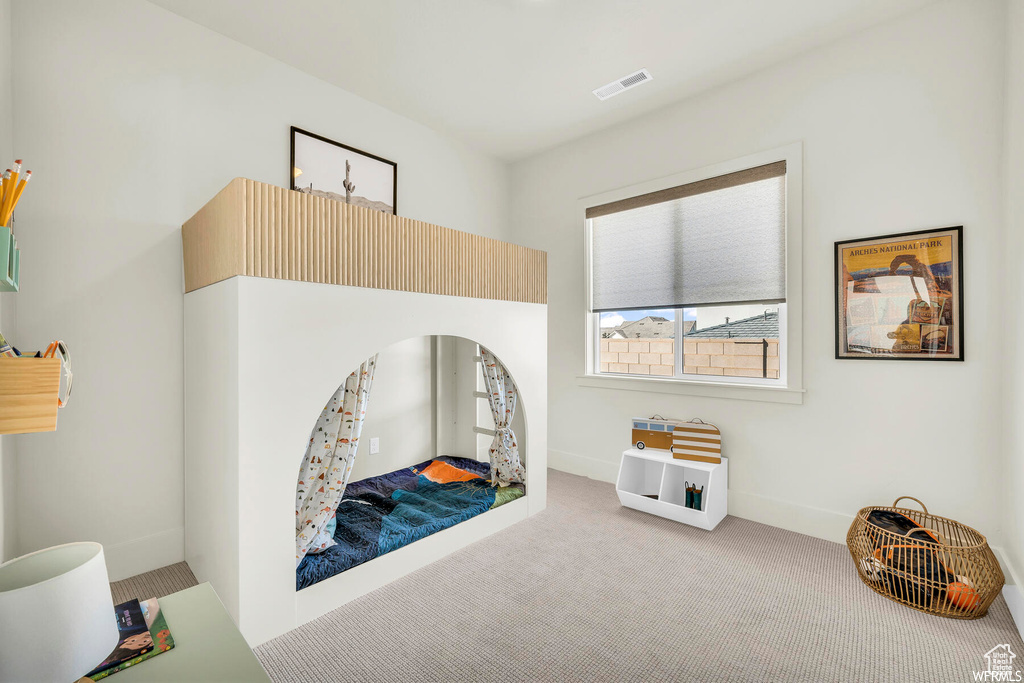 Interior space with carpet floors and baseboards