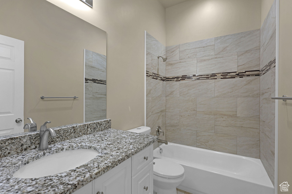 Bathroom featuring vanity and bathing tub / shower combination