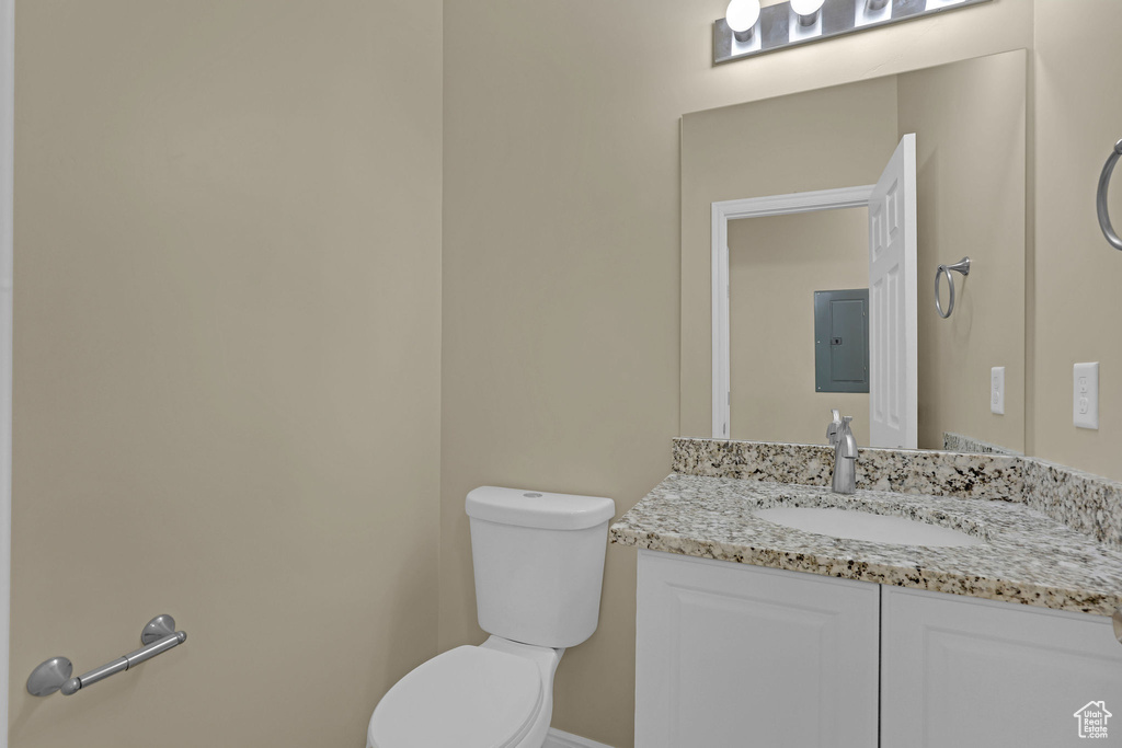 Bathroom with electric panel and vanity