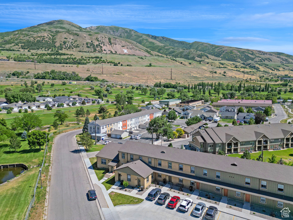 Aerial perspective of suburban area with a mountain backdrop