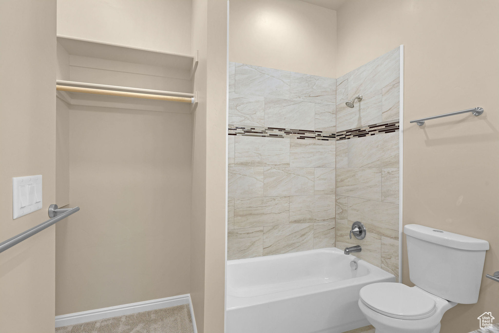 Full bathroom featuring bathtub / shower combination and toilet
