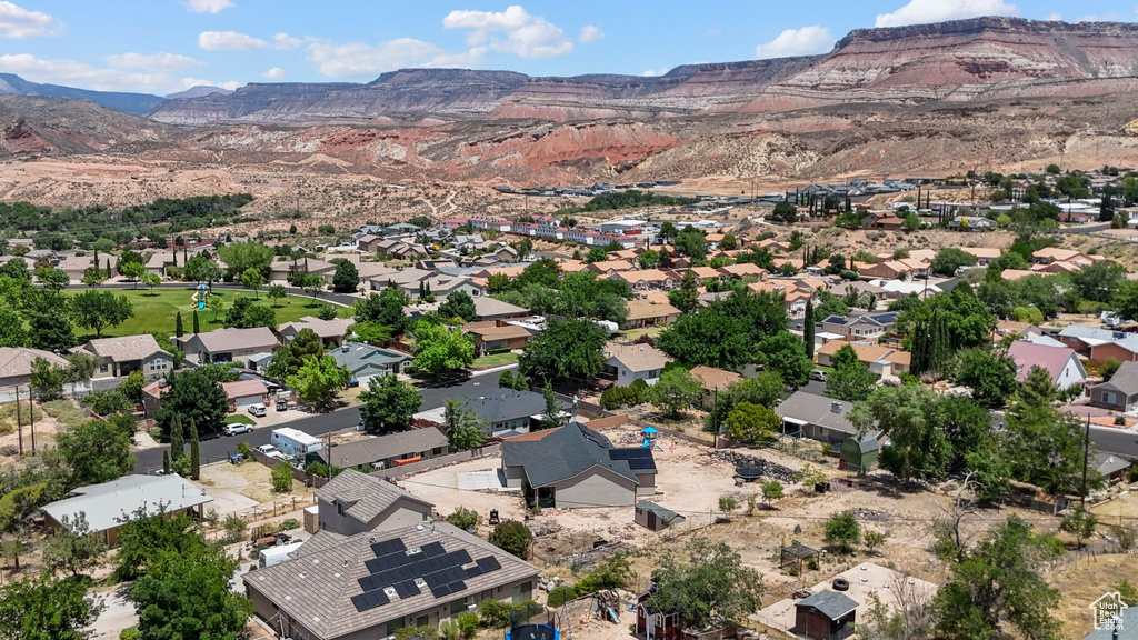 Aerial perspective of suburban area with a mountain backdrop