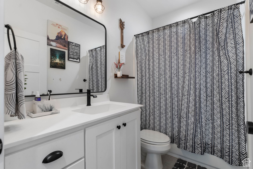 Full bathroom with vanity and shower / bath combination with curtain
