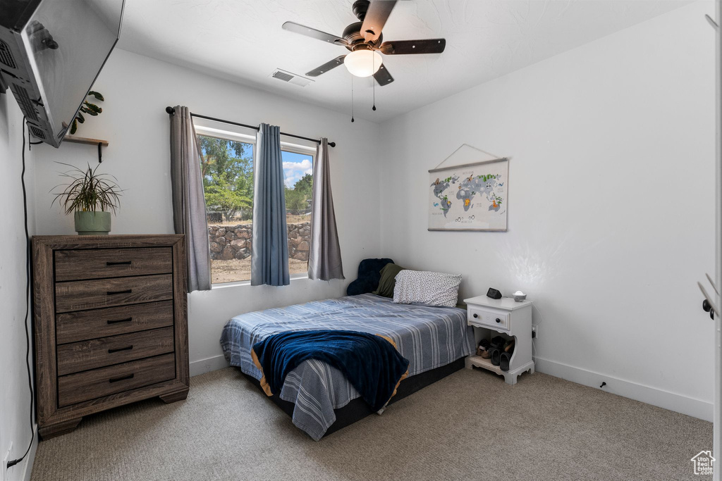 Bedroom featuring carpet flooring and ceiling fan