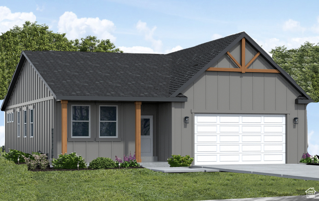 Modern farmhouse featuring roof with shingles, a garage, a front yard, and board and batten siding