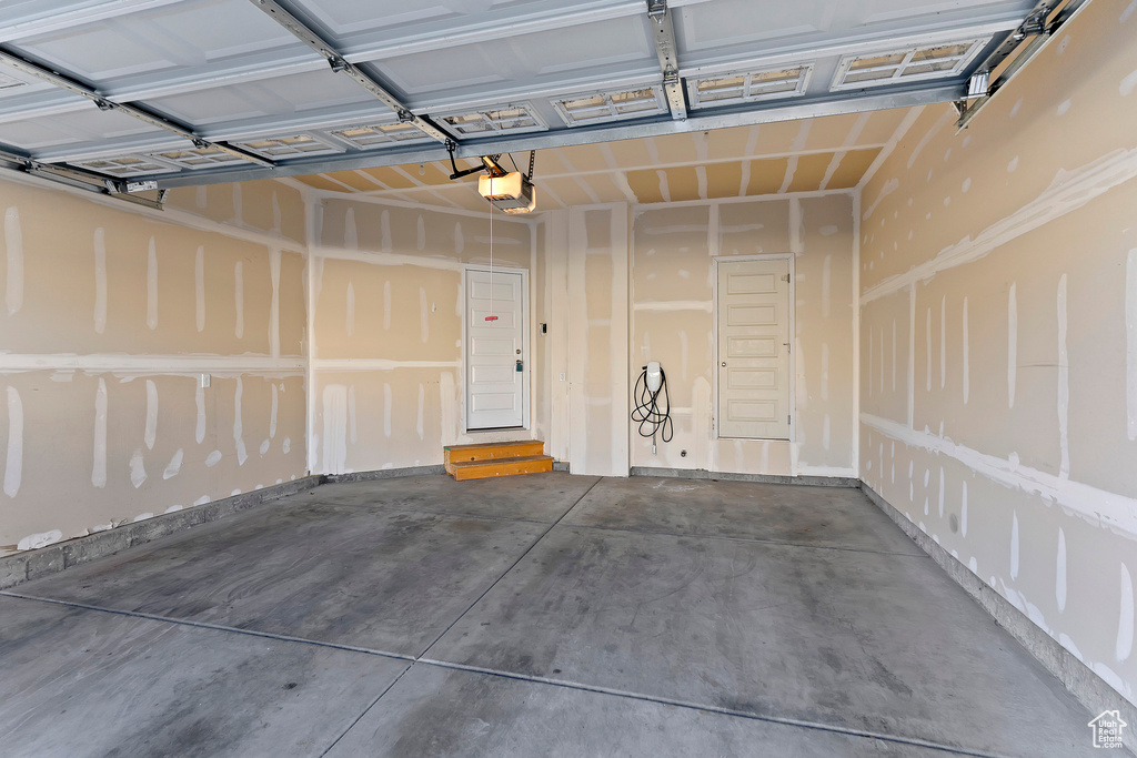 Garage featuring a garage door opener