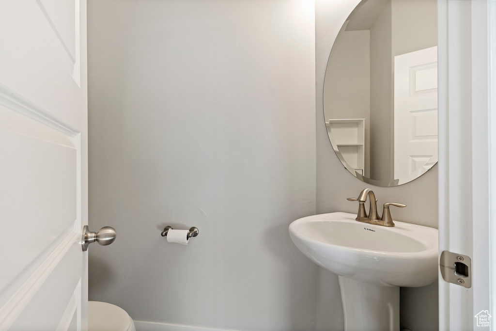 Bathroom featuring a sink and toilet