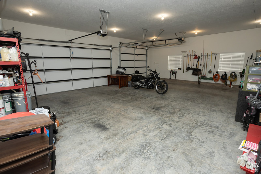 Garage featuring a garage door opener