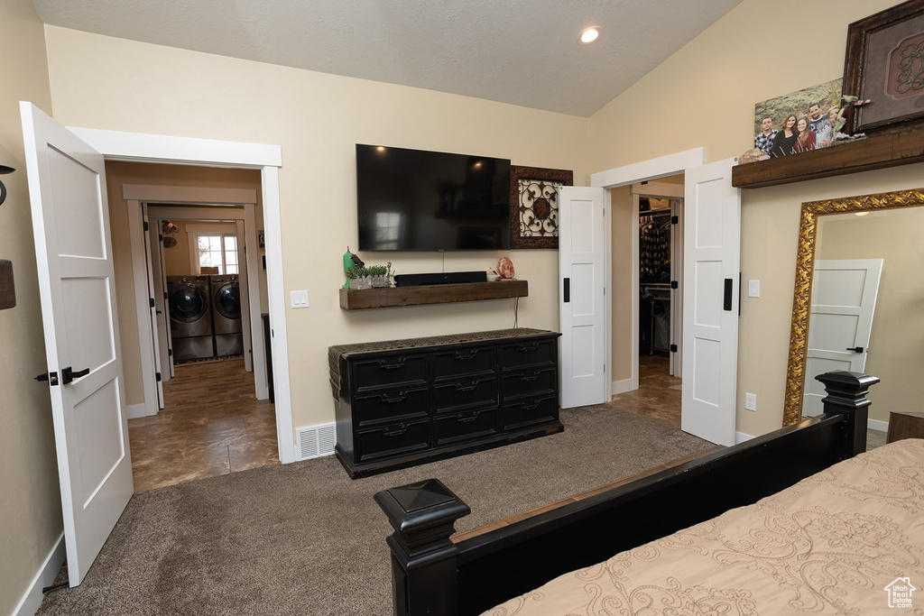 Carpeted bedroom featuring separate washer and dryer, lofted ceiling, and recessed lighting