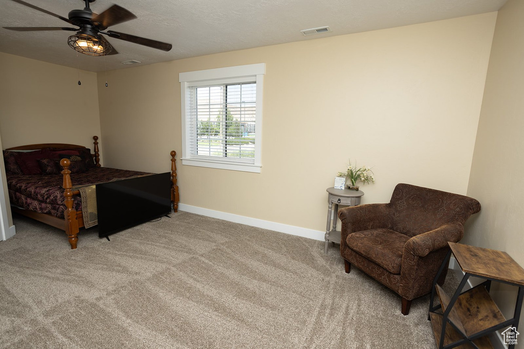 Bedroom featuring carpet flooring and ceiling fan