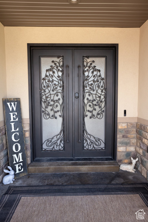 Property entrance with stucco siding