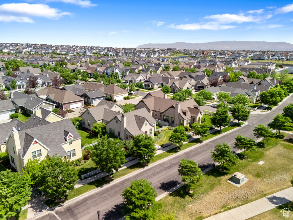 Aerial view of residential area featuring a mountain backdrop