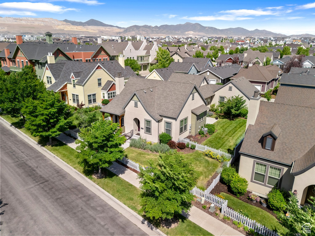 Aerial view of residential area featuring a mountain backdrop