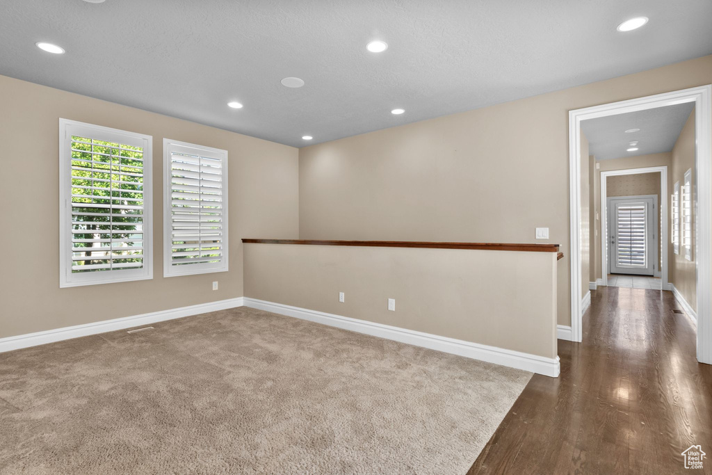 Spare room with recessed lighting and wood finished floors