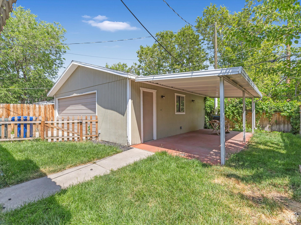 View of front of home with a detached garage