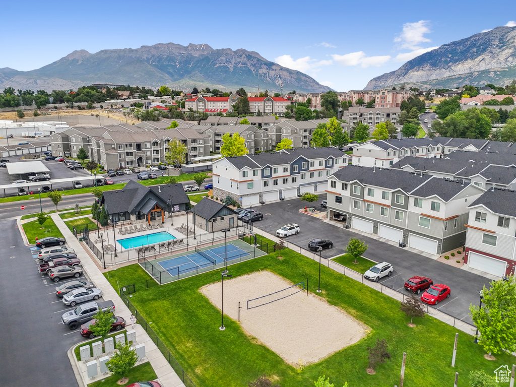 Drone / aerial view of a mountainous background and a pool