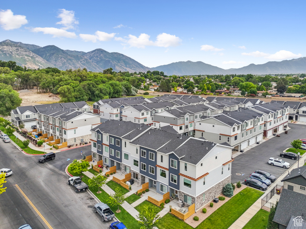 Aerial perspective of suburban area with a mountain backdrop
