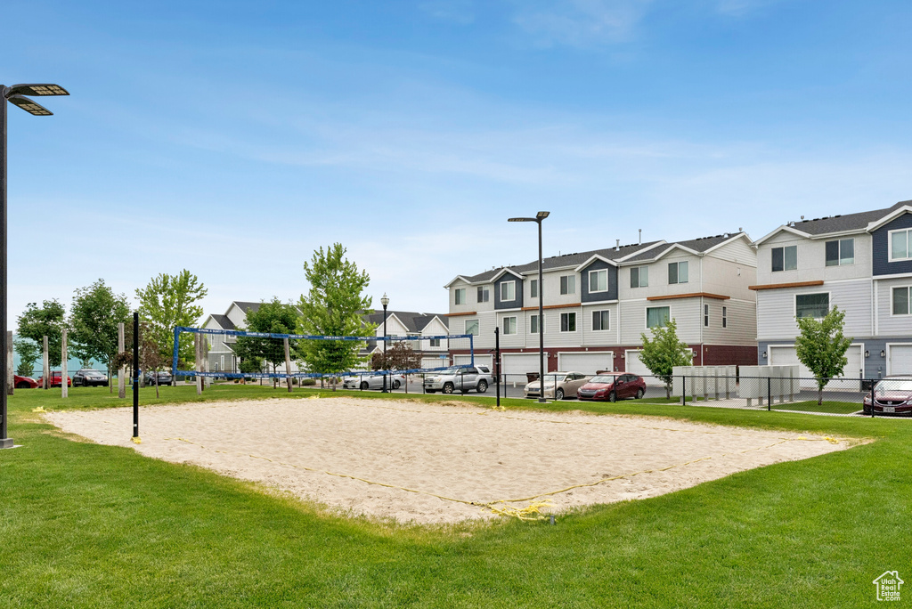 View of home\'s community featuring a residential view, volleyball court, and a yard