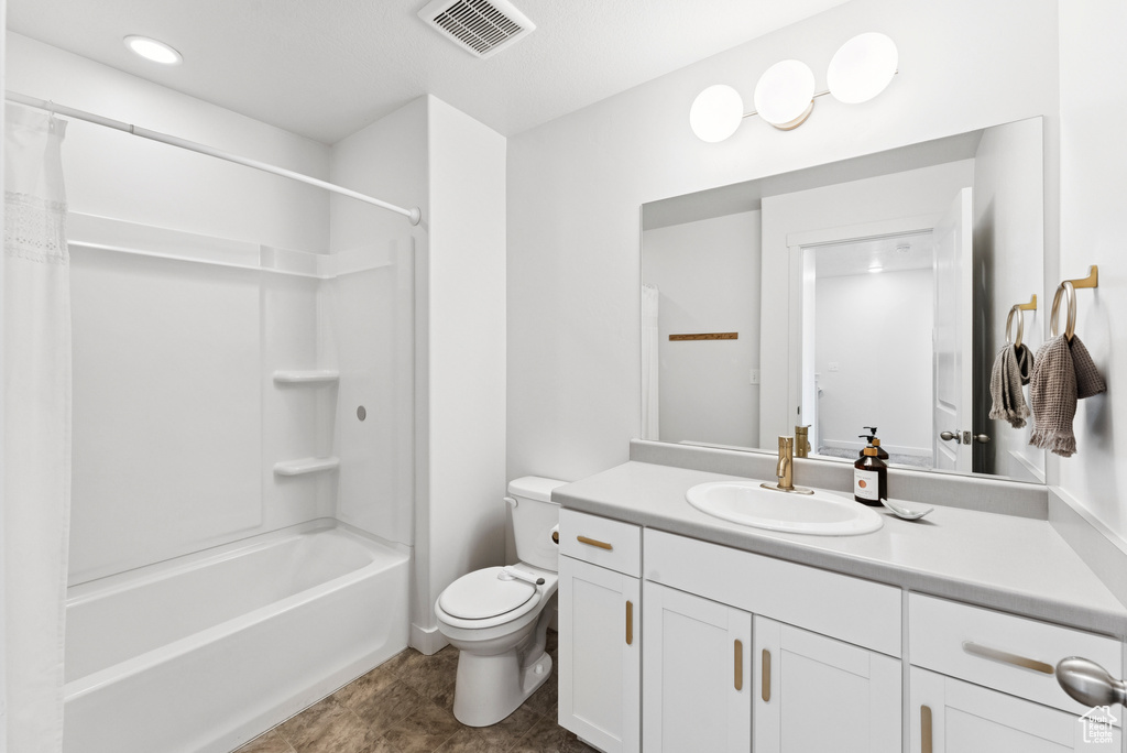 Full bath featuring vanity and shower / bath combo