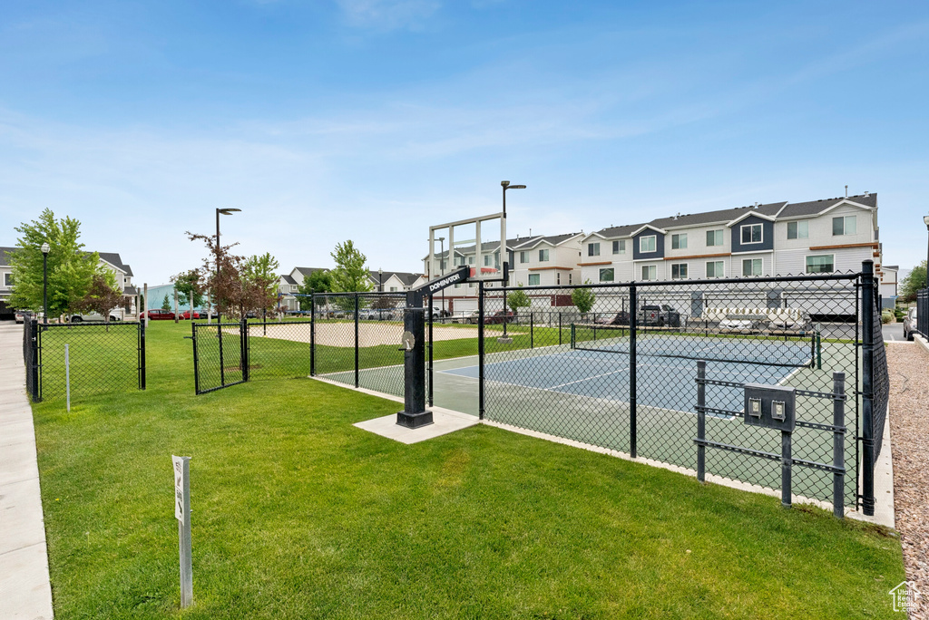 View of sport court with a residential view and community basketball court