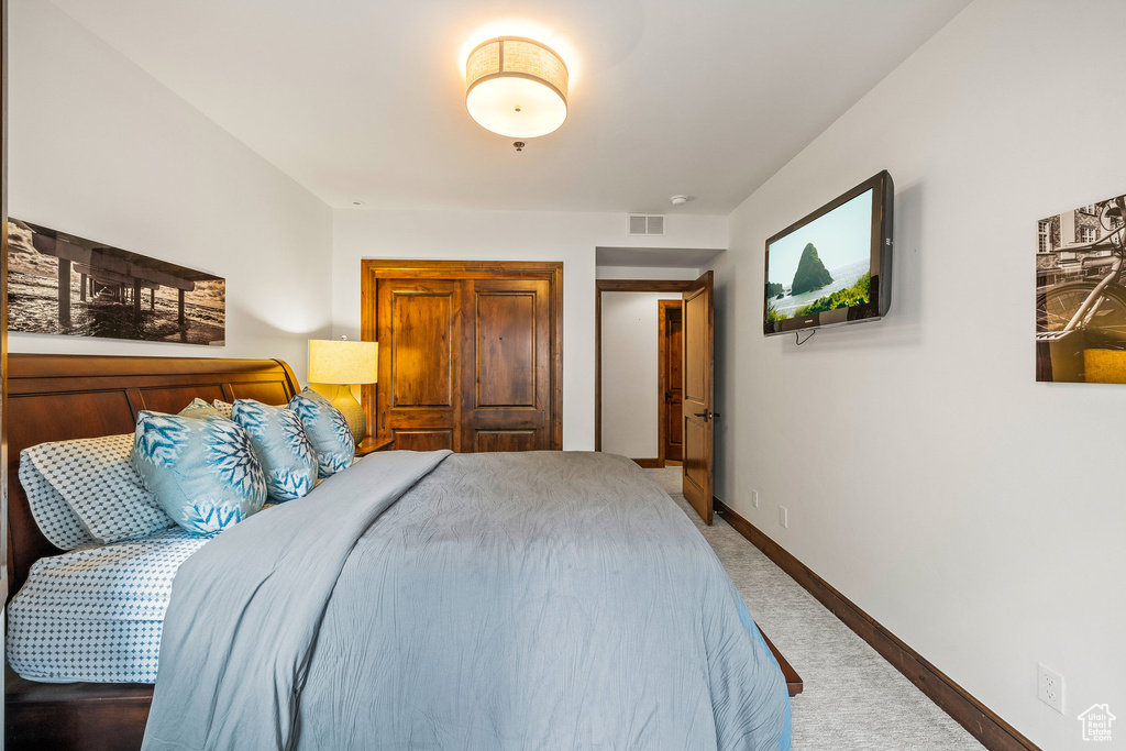 Carpeted bedroom with baseboards