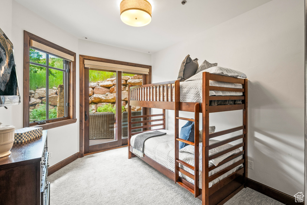 Bedroom featuring carpet flooring and access to outside