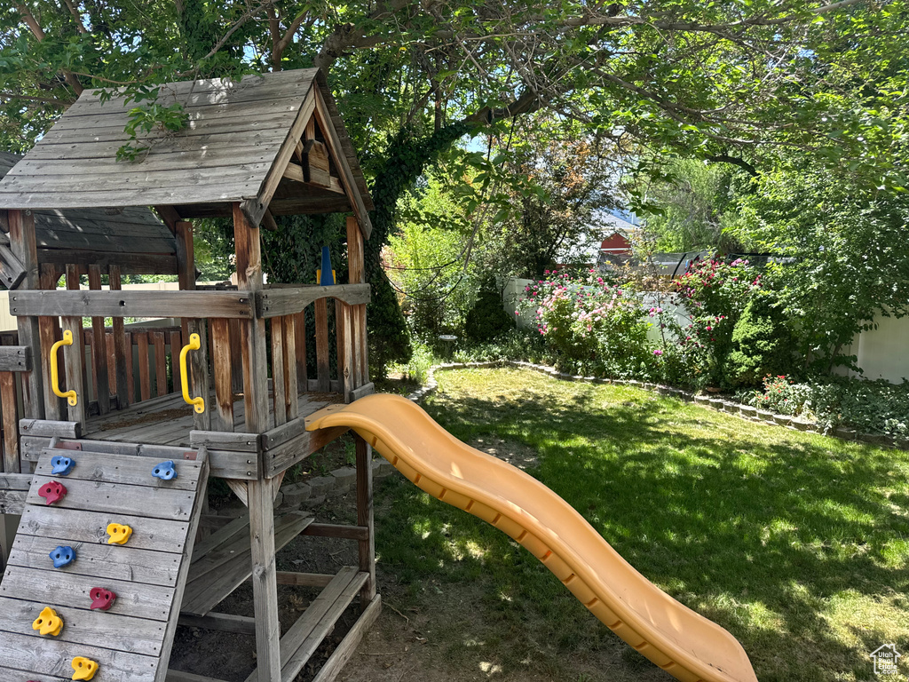 View of playground featuring a yard