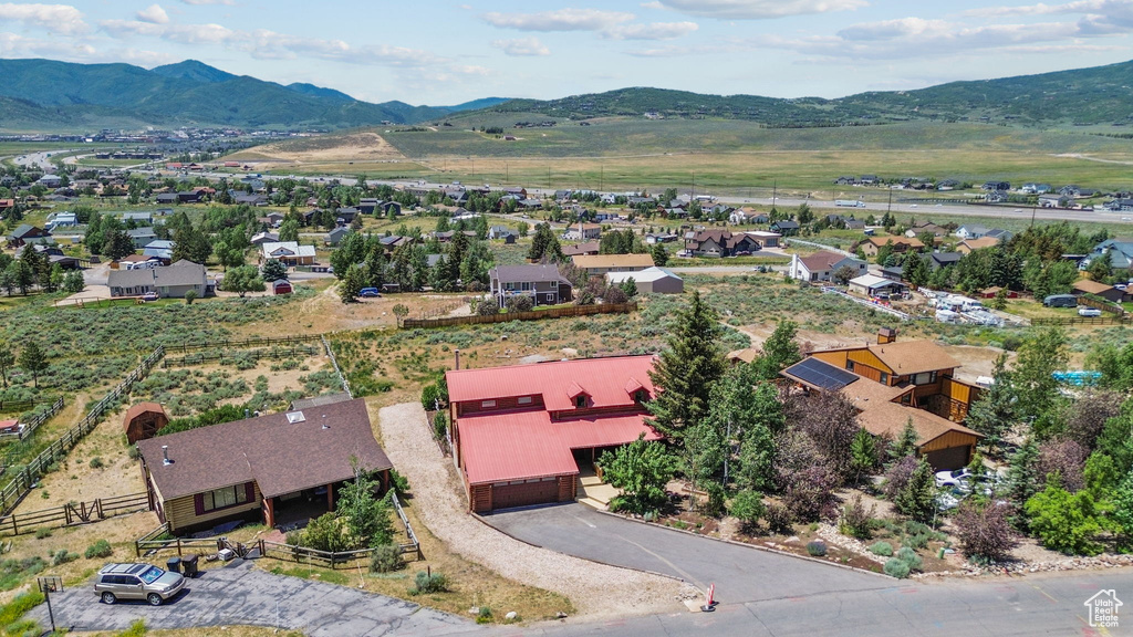 Aerial perspective of suburban area with a mountain backdrop