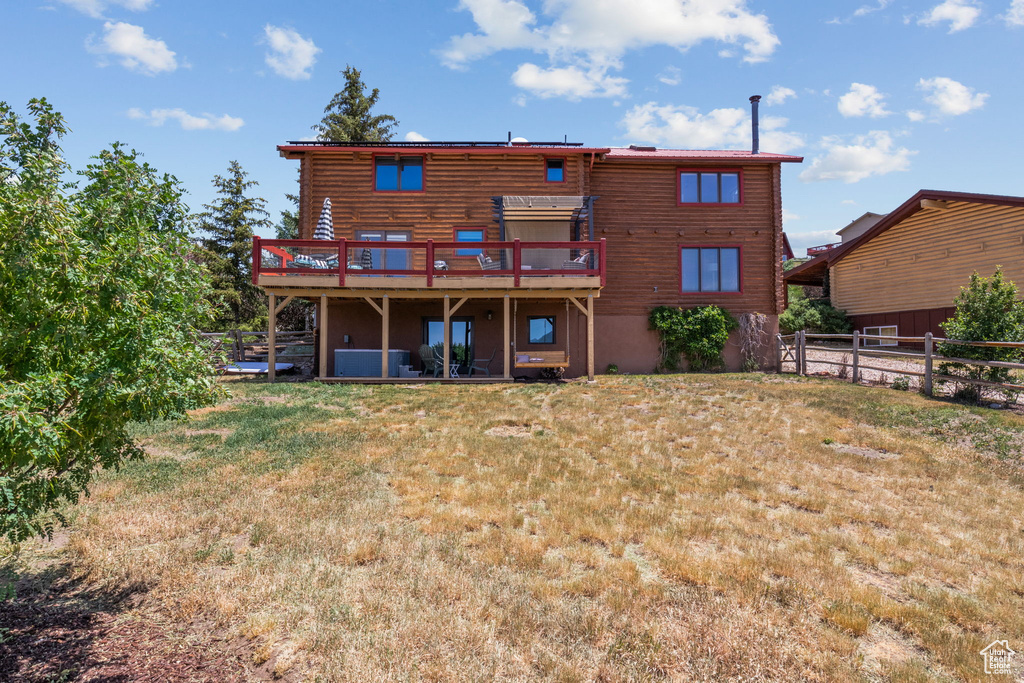 Back of property featuring a deck