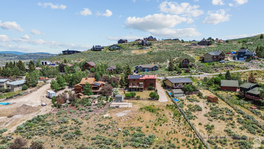Aerial perspective of suburban area featuring a mountainous background