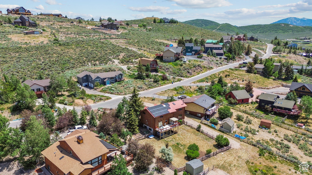 Aerial view of residential area with a mountainous background