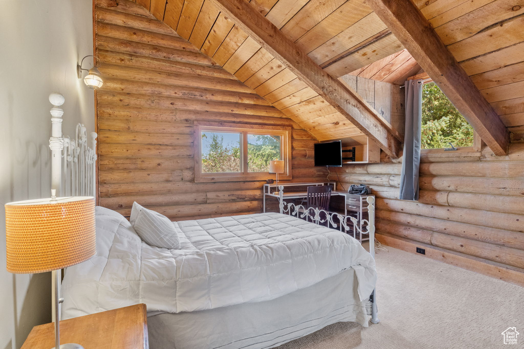 Carpeted bedroom featuring wooden ceiling and log walls