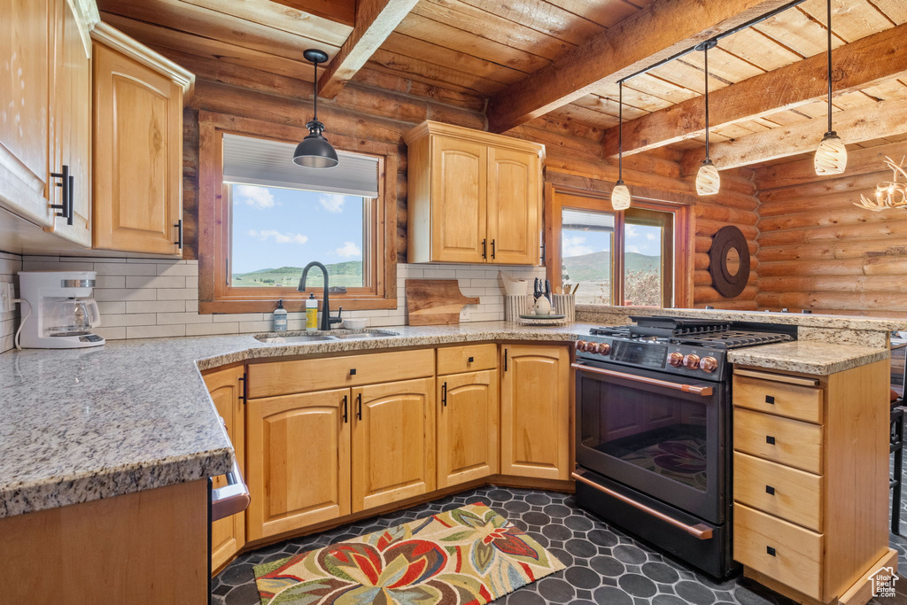 Kitchen featuring gas stove, a peninsula, a wooden ceiling with exposed beams, log walls, and backsplash