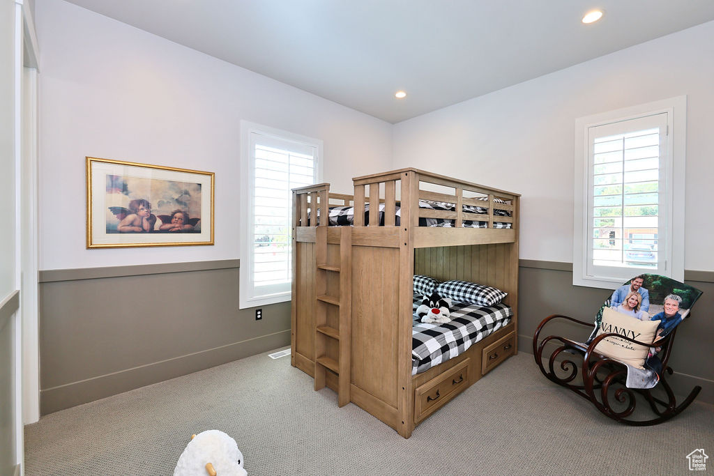 Carpeted bedroom with recessed lighting