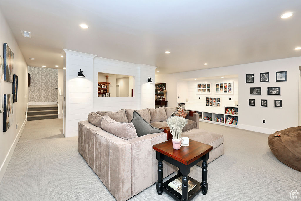 Living room featuring light colored carpet and recessed lighting